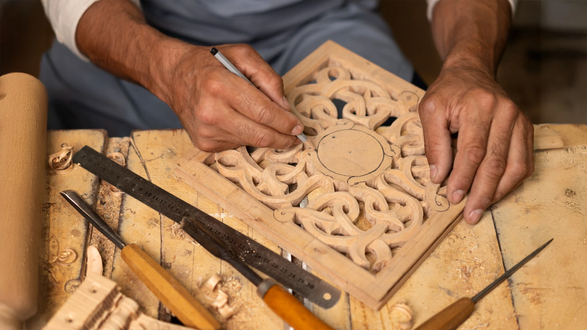 Hand-carving decorative wood panel for custom wooden work services in Dubai.